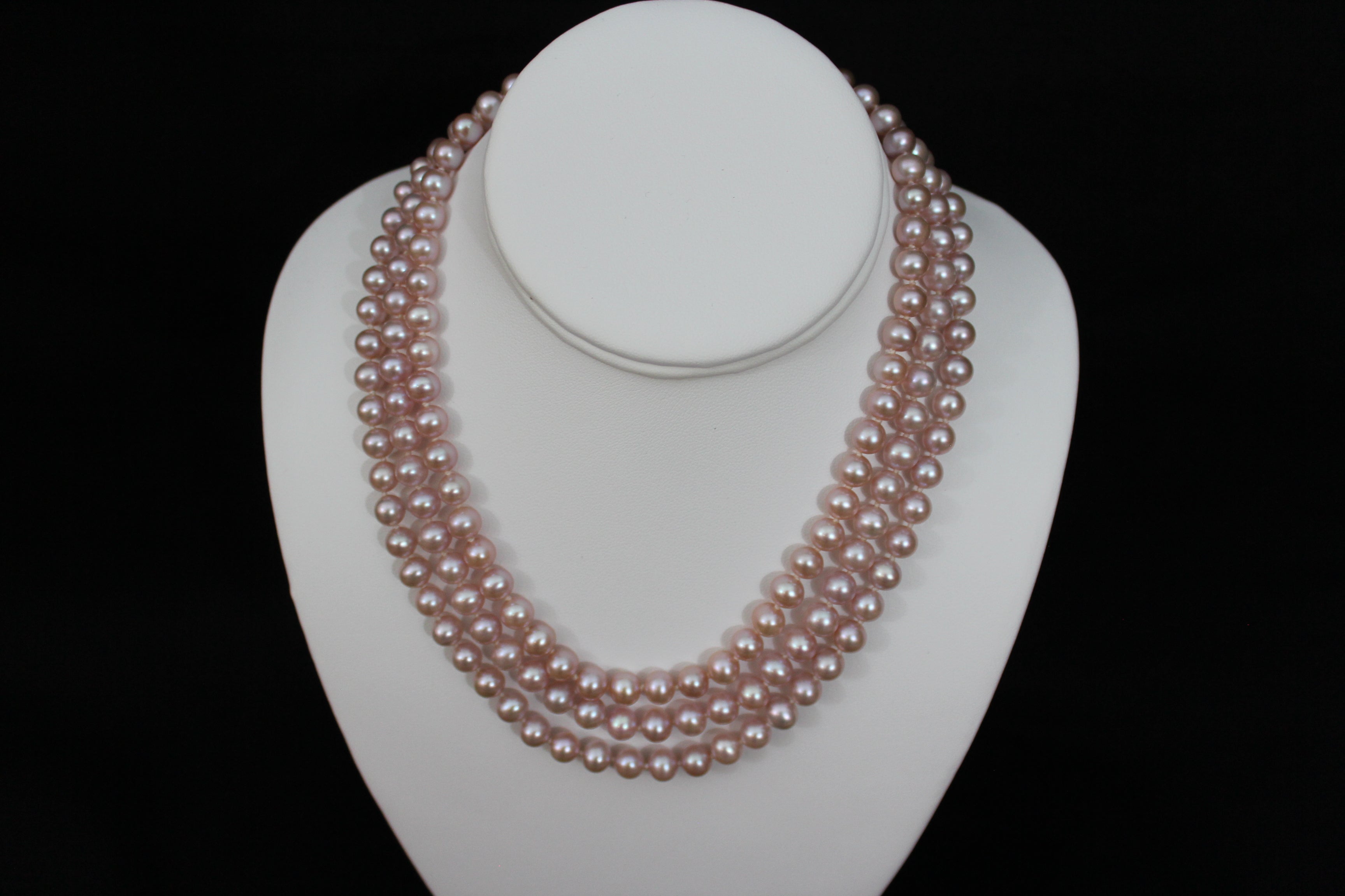 Pink rose cultured semi round pearl necklace triple strand with 14 karat gold lock.  (Free shipping and taxes).