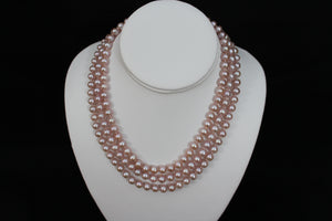 Pink rose cultured semi round pearl necklace triple strand with 14 karat gold lock.  (Free shipping and taxes).