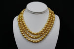 Load image into Gallery viewer, Gold color cultured button pearl necklace triple strand with 14 karat gold lock.  (Free shipping and taxes).
