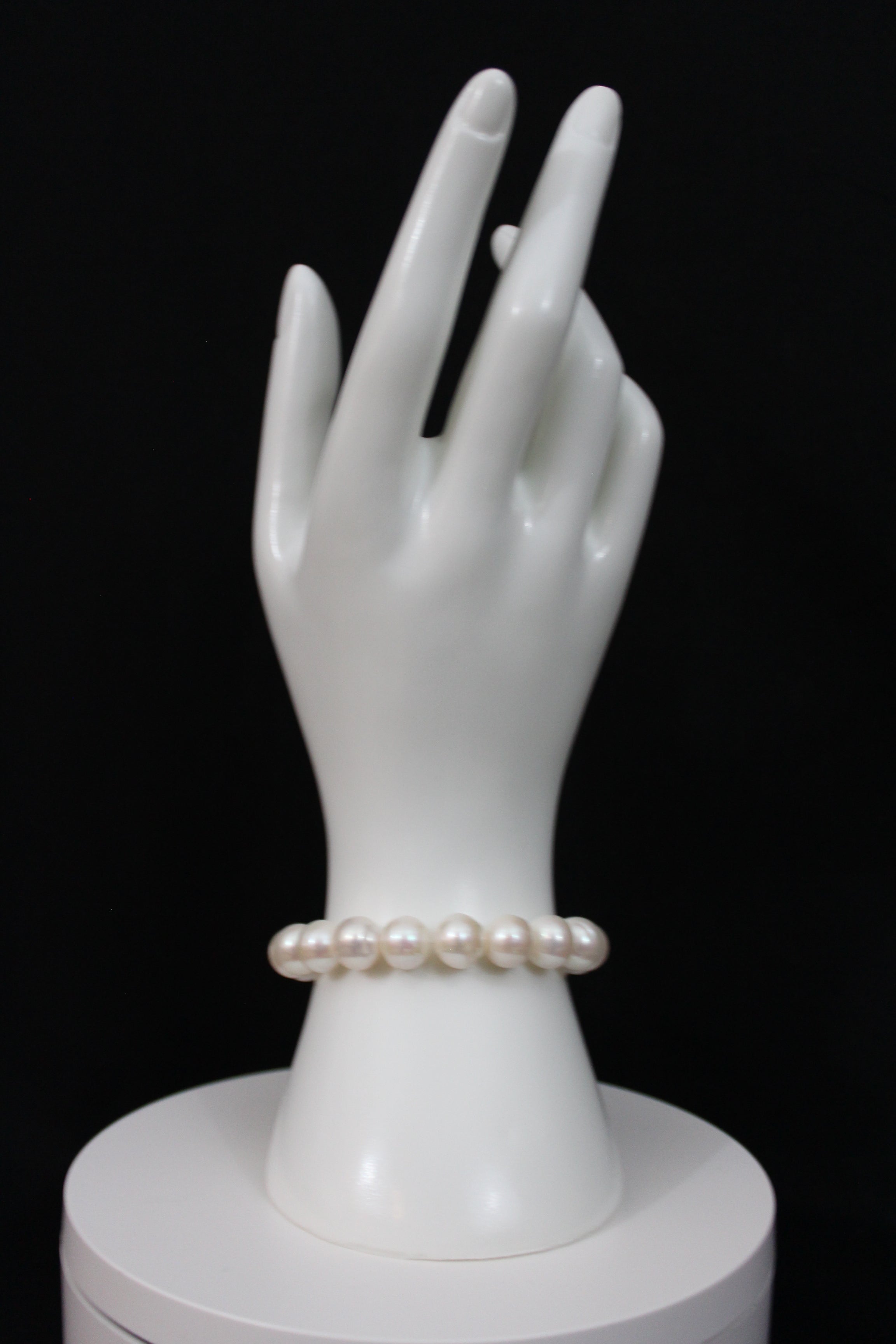 White color cultured  circled baroque pearl bracelet single strand with 14 karat gold lock.  (Free shipping and taxes).