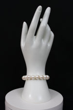 Load image into Gallery viewer, White color cultured  circled baroque pearl bracelet single strand with 14 karat gold lock.  (Free shipping and taxes).
