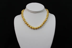 Gold color cultured button pearl necklace single strand with 14 karat gold clasp.  (Free shipping and taxes).