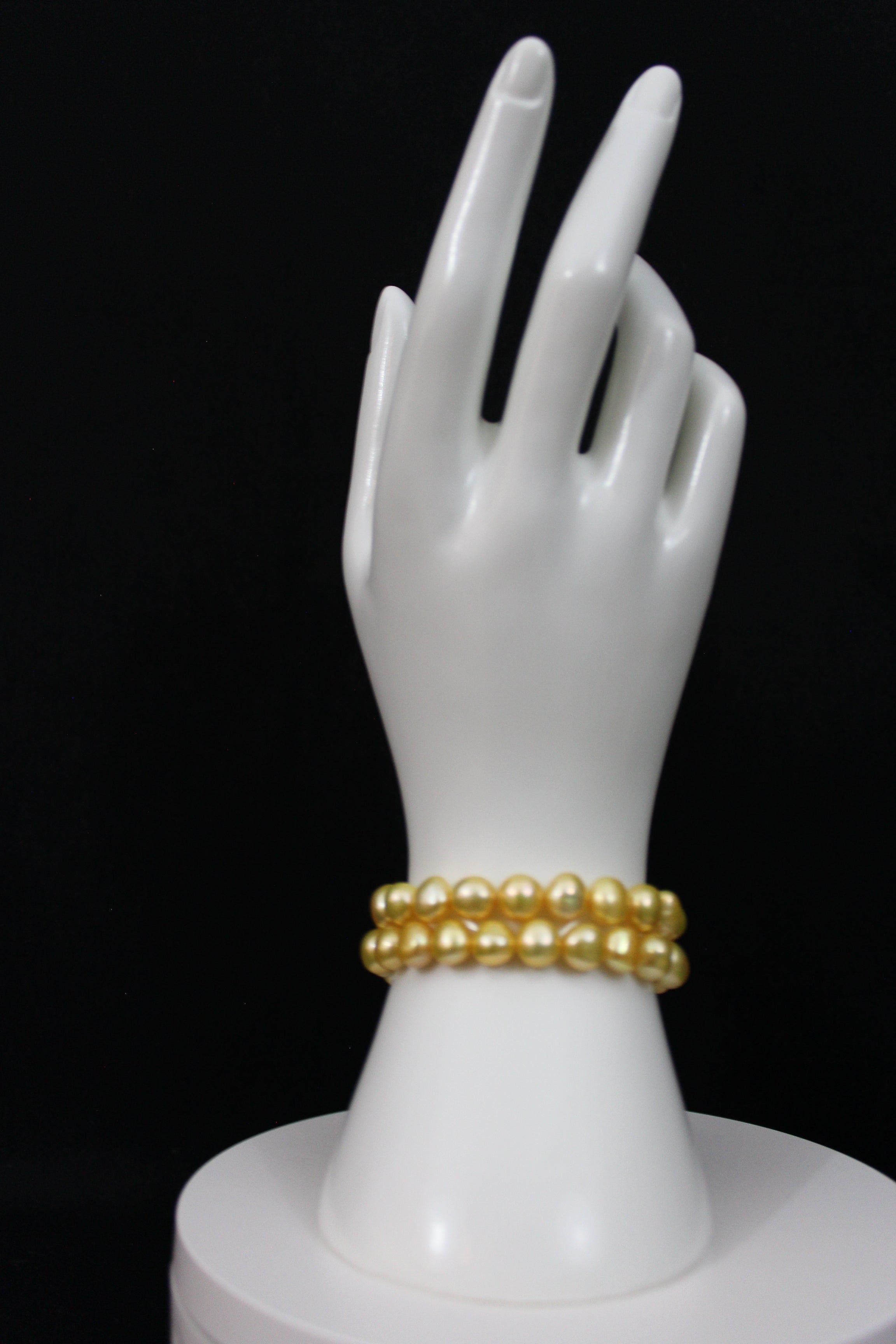 Gold color cultured button pearl shape bracelet 2 strands with 14 karat gold clasp.  (Free shipping and taxes).