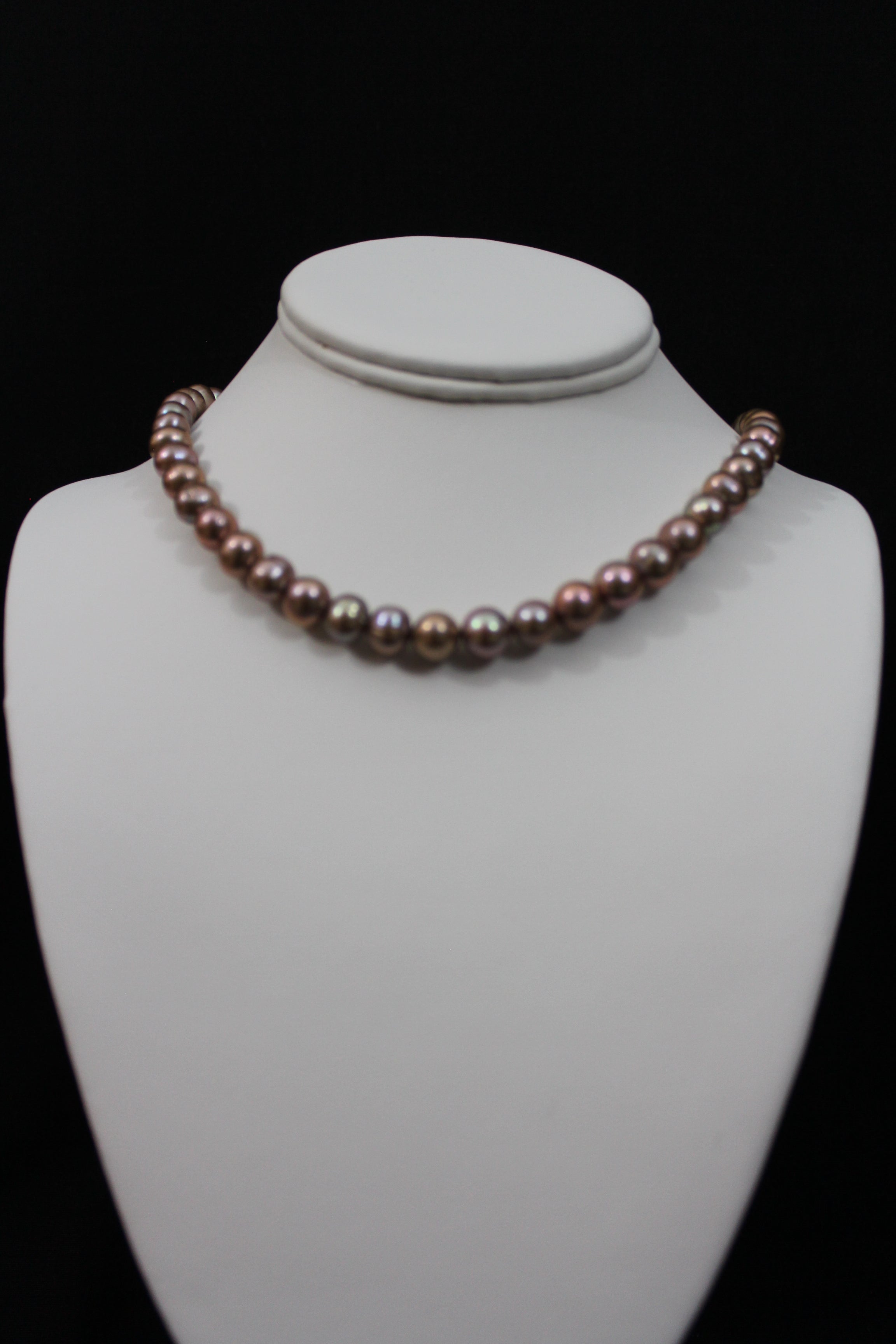 Rose gold cultured circled baroque pearl necklace single strand with 14 karat gold clasp.  (Free shipping and taxes).