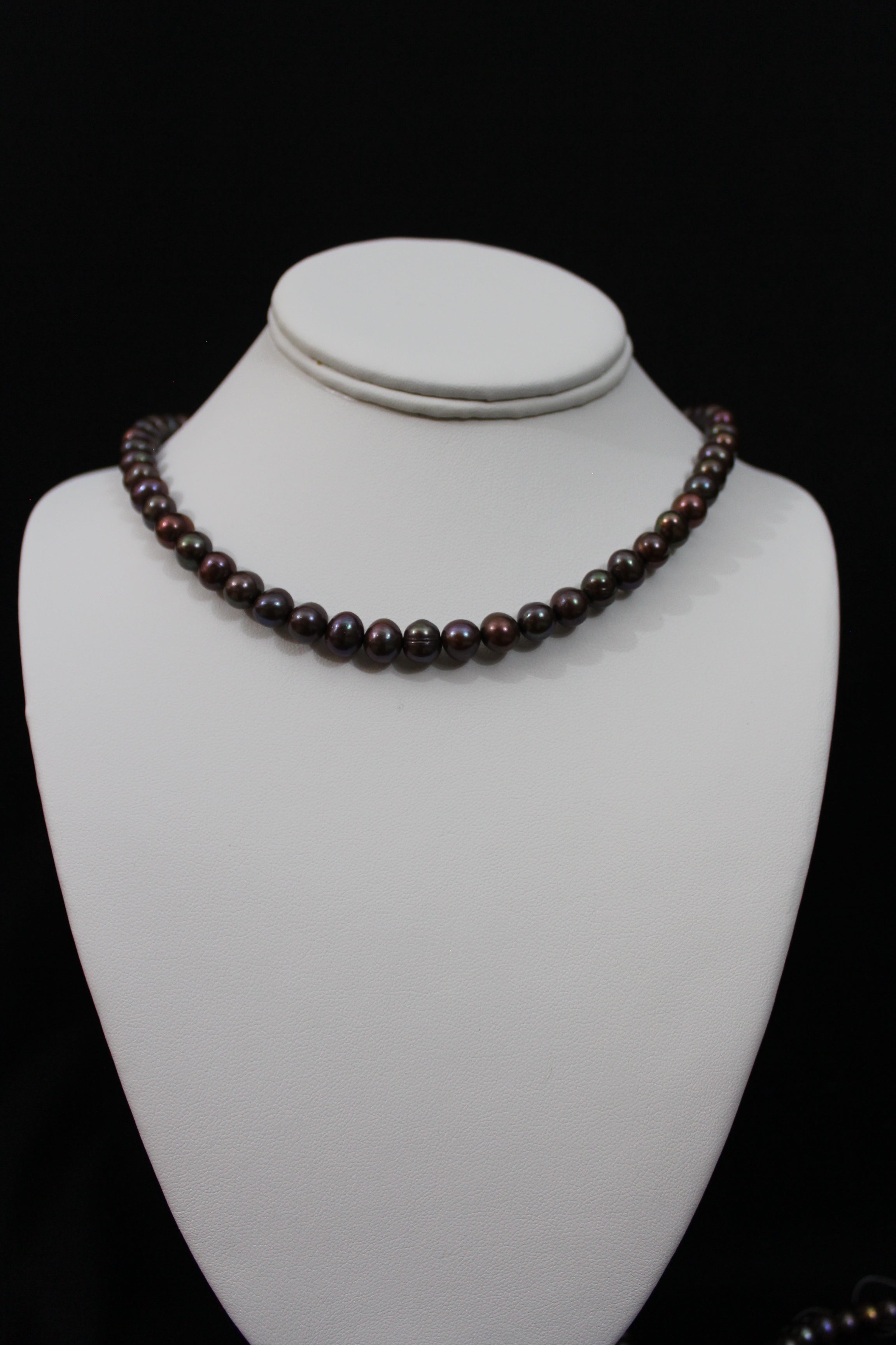 Multi color brown cultured semi round pearl necklace single strand with 14 karat gold clasp.  (shipping and taxes free).