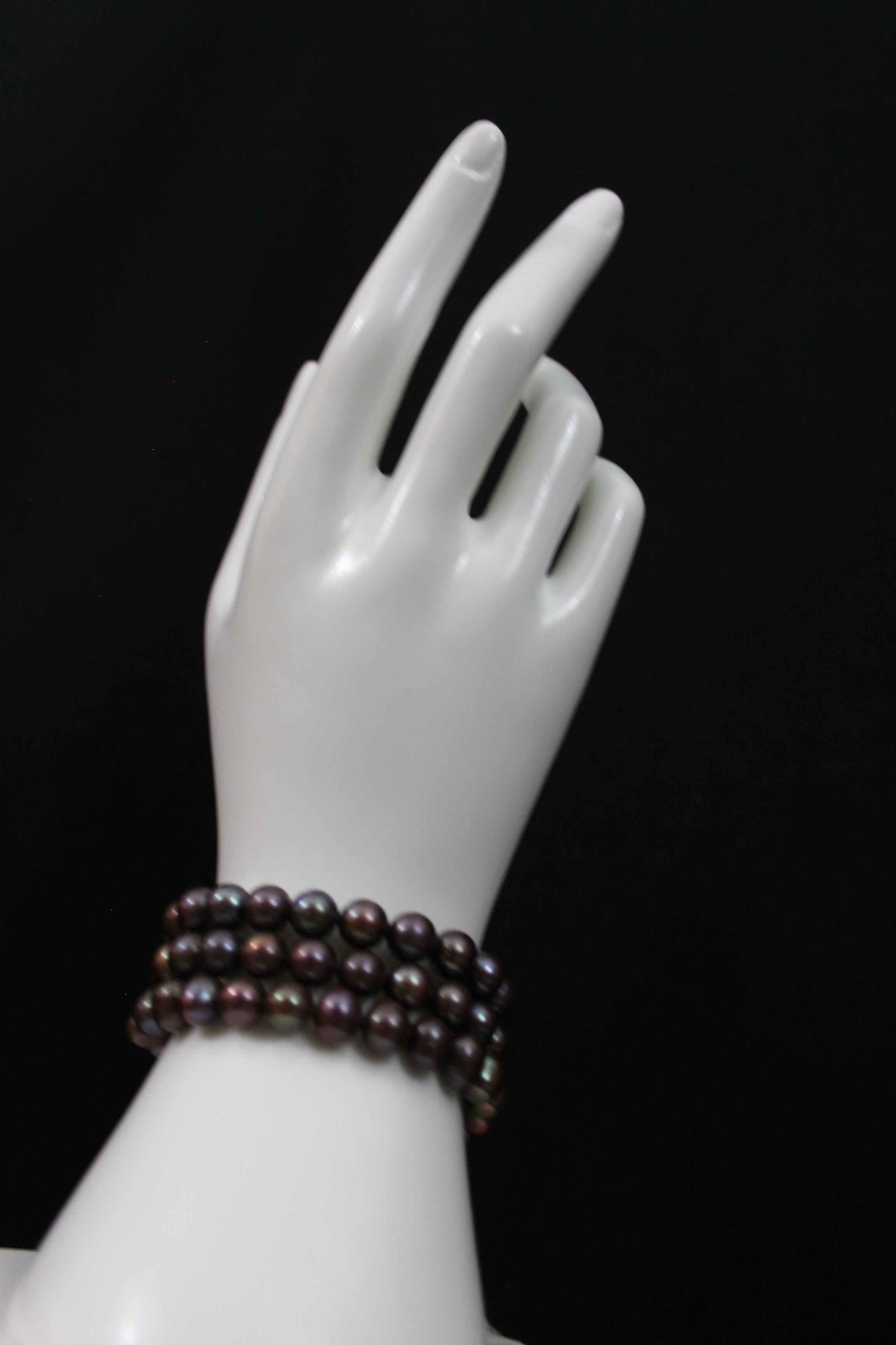 Multi color brown cultured semi round pearl bracelet triple strand with 14 karat gold clasp.  (shipping and taxes free).