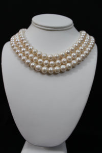 White color cultured circled baroque pearl necklace triple strand with 14 karat gold clasp.  (Free shipping and taxes).