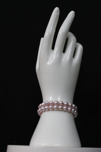 Pink rose cultured semi-round pearl bracelet 2 strands with 14 karat gold clasp.  (Free shipping and taxes).