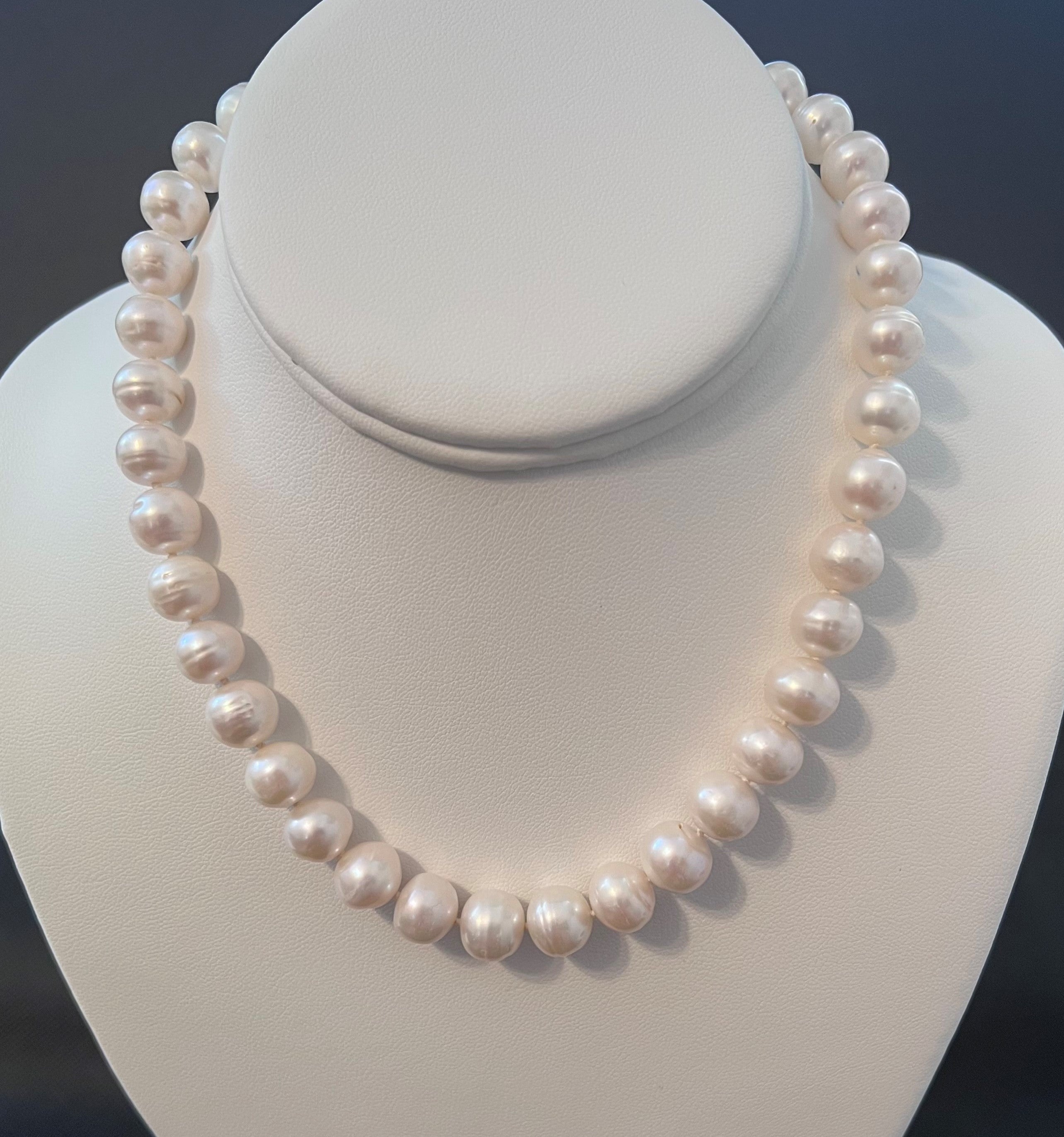 White color cultured circled baroque pearl single strand necklace with 14 karat gold lock.  (Free shipping and taxes).