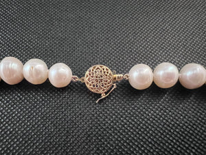 White color cultured circled baroque pearl single strand necklace with 14 karat gold lock.  (Free shipping and taxes).