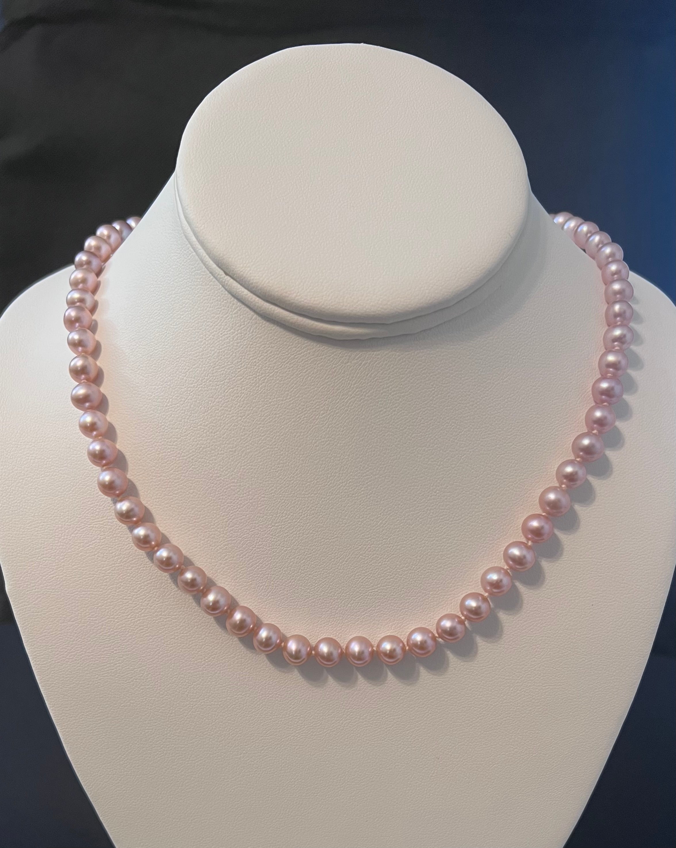 Pink rose cultured single strand semi round pearl necklace with 14 karat gold clasp.  (Free shipping and taxes).