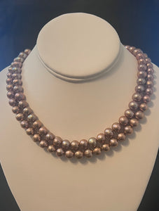 Rose gold cultured circled baroque pearl necklace double strand with 14 karat gold clasp.  (Free shipping and taxes).