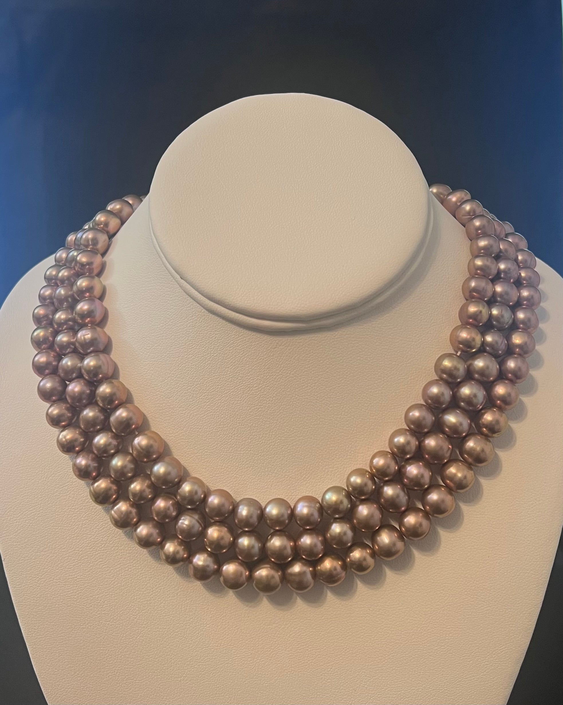 Rose gold cultured circled baroque pearl necklace triple strand with 14 karat gold clasp.  (Free shipping and taxes).