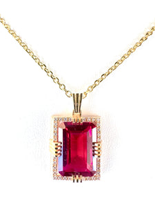 Ruby created center stone 18 Karat gold Pendant with gold chain and garnished with 32 round clear synthetic diamonds.     (Free shipping and taxes).